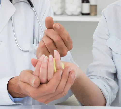 Doctor examining a diabetic patient's hand
