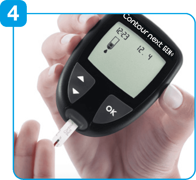 Touch the tip of the test strip to the drop of blood